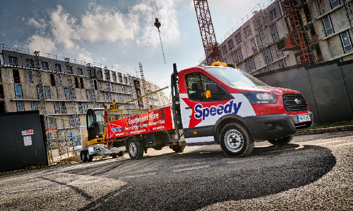 A red and white Speedy equipment hire vehicle